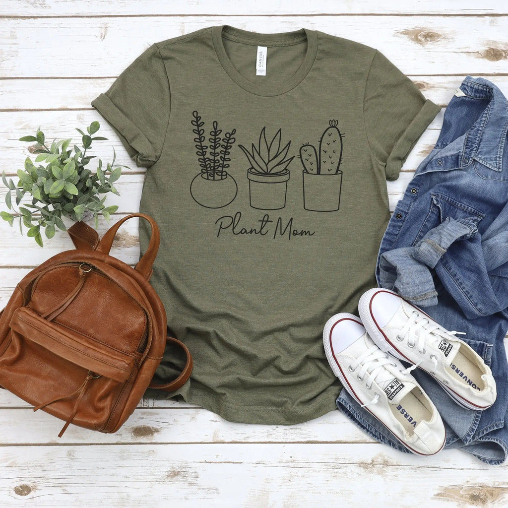 Olive green unisex t-shirt with potted plant graphic and “Plant Mom” text