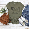 Olive green unisex t-shirt with potted plant graphic and “Plant Mom” text