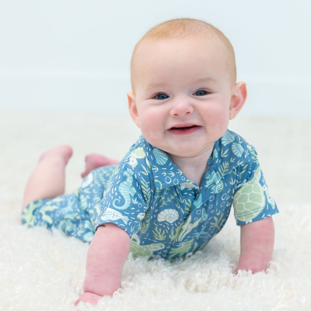 Boy polo romper in blue sea-life print, short sleeves and button placket