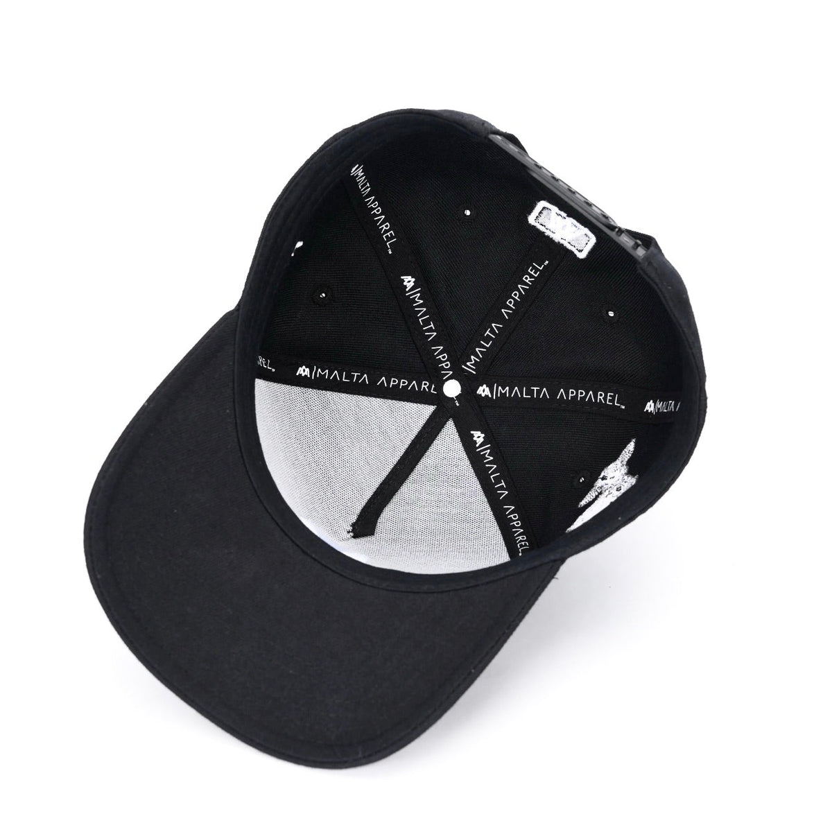 Black snapback cap interior with circular brand print and labels