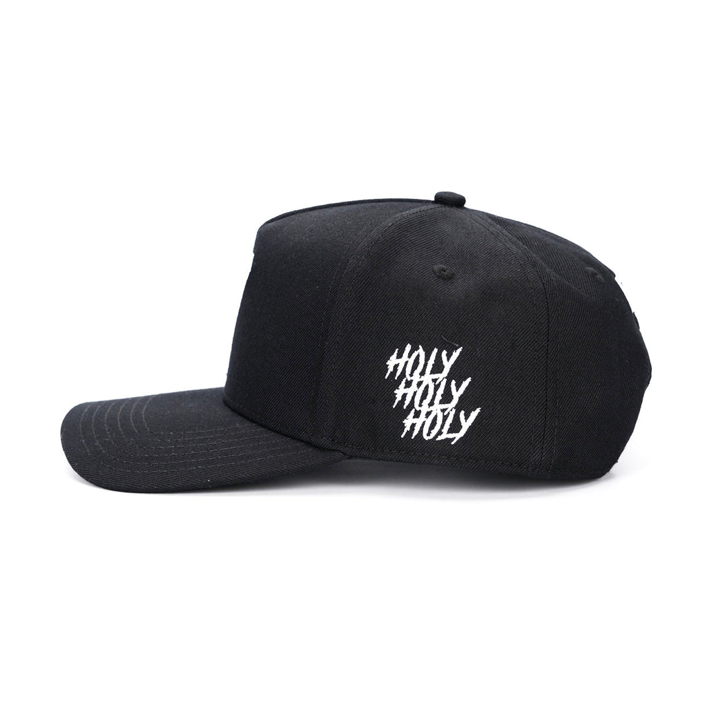 Black snapback cap with white 'Holy Holy Holy' text on side