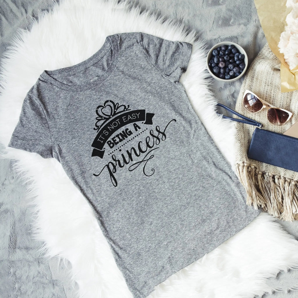 Dark gray graphic princess t-shirt with 'It's not easy being a princess' print.