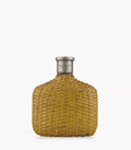 Woven straw-look perfume bottle with metal cap, rounded shoulders