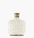 Perfume bottle with white lattice-pattern glass and gold-toned cap