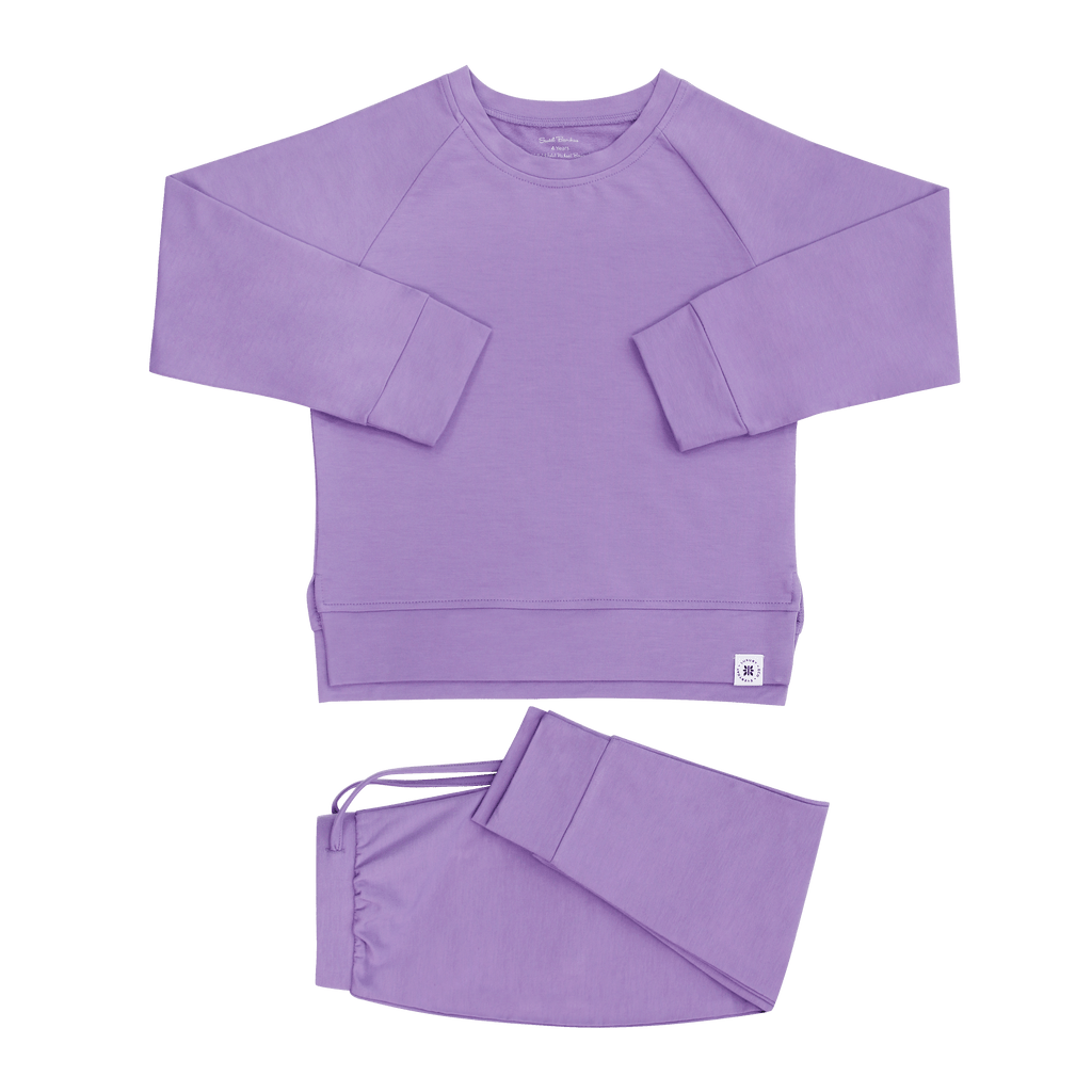 Purple crew neck sweatshirt and matching jogger pants set, flat lay