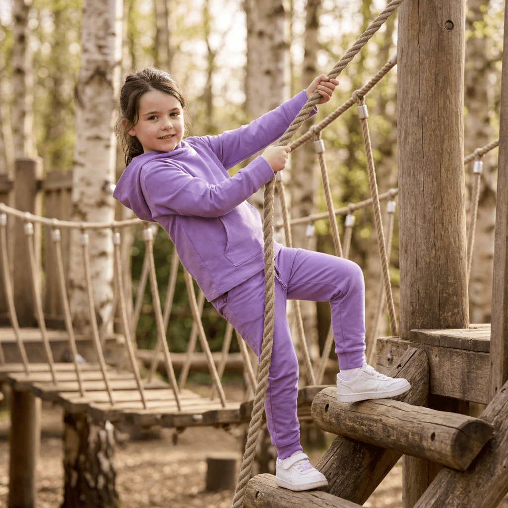 Purple hooded jogger set with long-sleeve hoodie and jogger pants on child outdoors