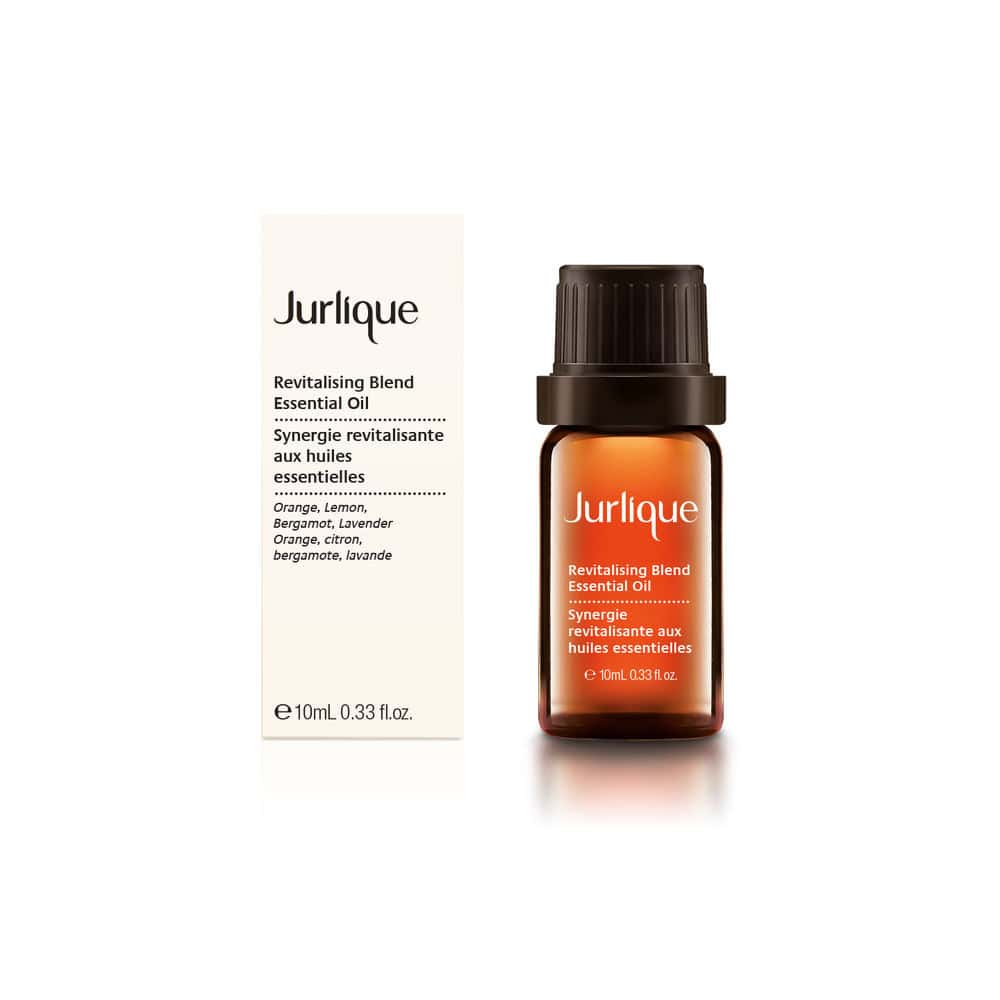Jurlique revitalizing blend essential oil bottle with dark amber glass and black cap
