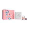 RéVive neck essentials set with pink gift box, serum jar, and two small creams