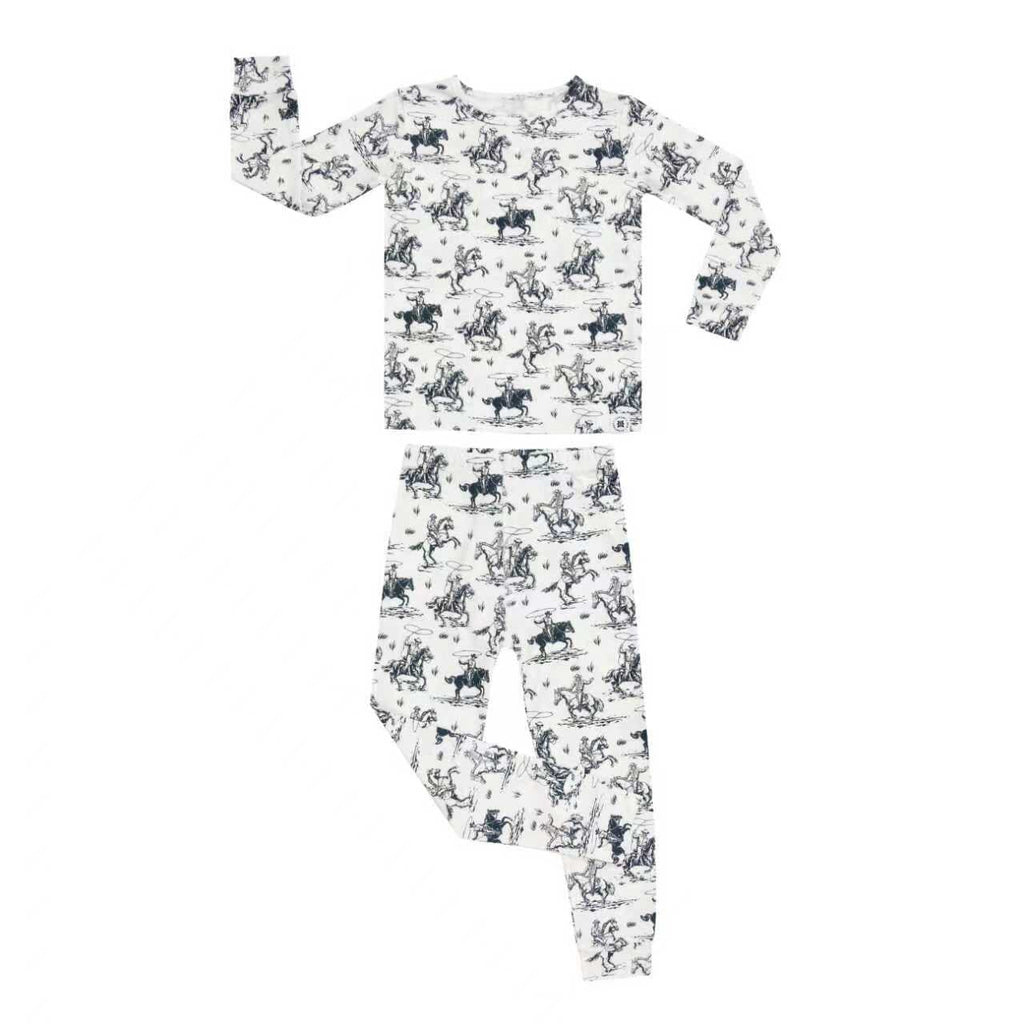 Kids pajama set in white with blue cowboy print, long-sleeve top and pants
