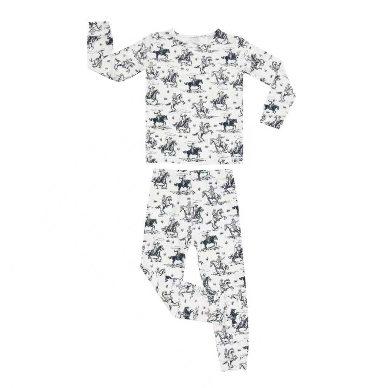 Kids pajama set in white with blue cowboy print, long-sleeve top and pants