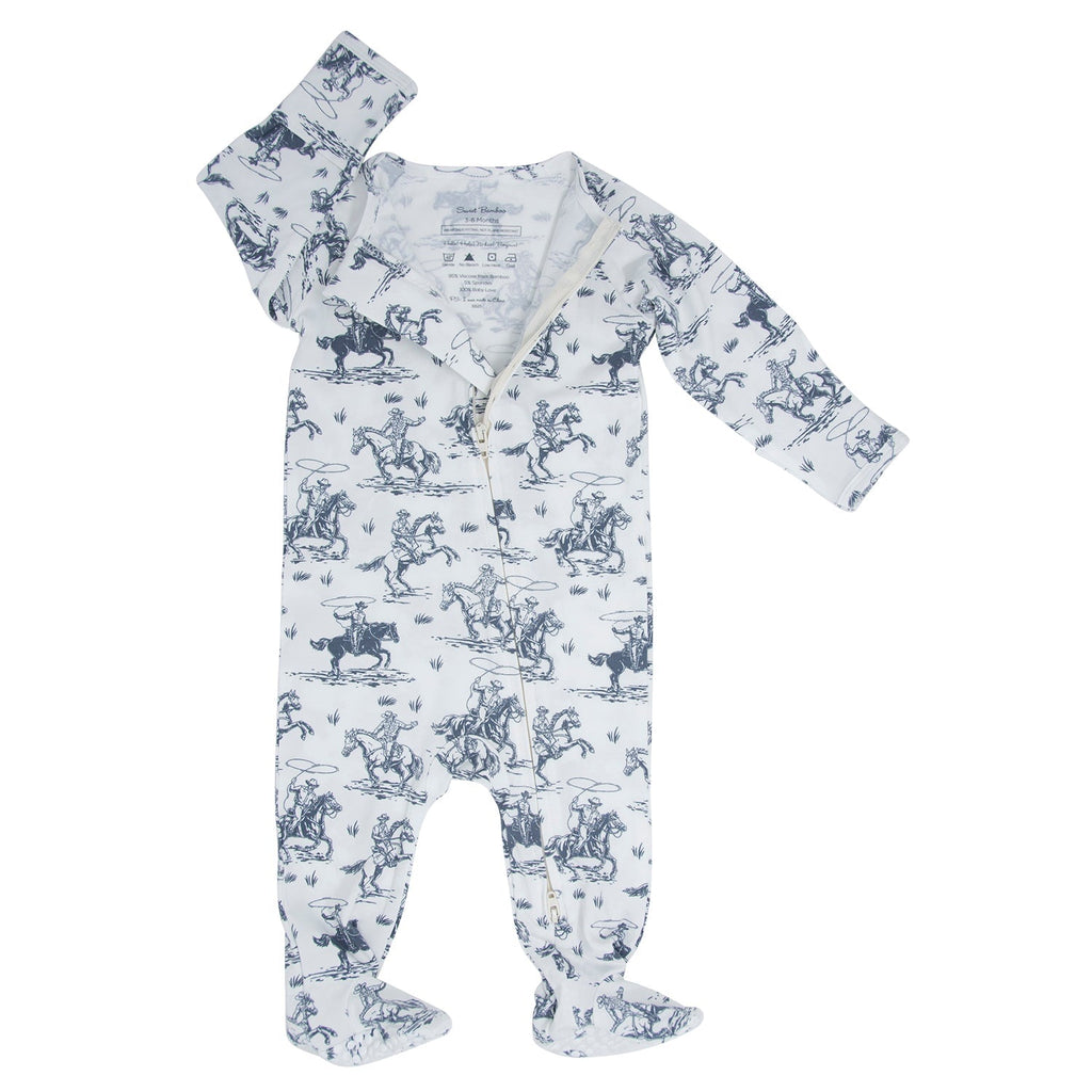 White zip-front footie with blue cowboy print, long sleeves and ankle cuffs