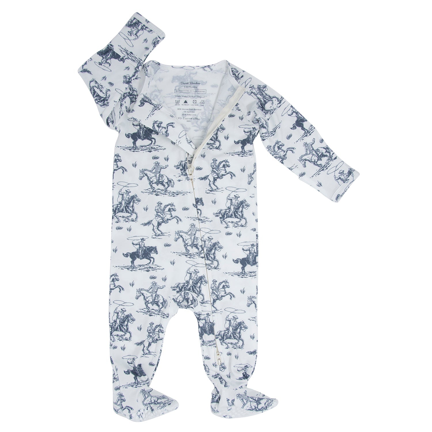White zip-front footie with blue cowboy print, long sleeves and ankle cuffs