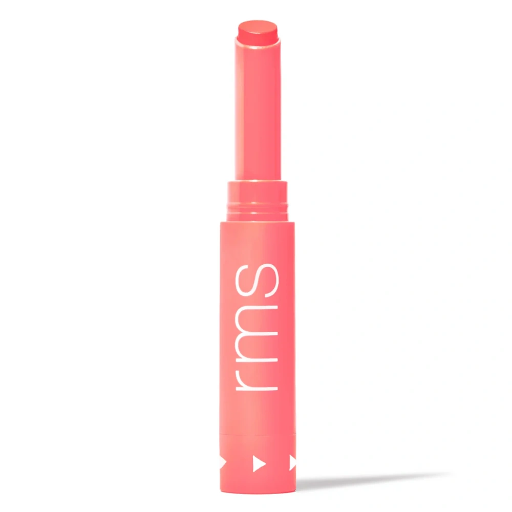 Legendary Serum Lipstick, coral pink tube with rounded top and lip balm applicator.
