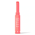 Legendary Serum Lipstick, coral pink tube with rounded top and lip balm applicator.