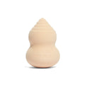 Beige beauty sponge with rounded teardrop shape, stamped rms beauty
