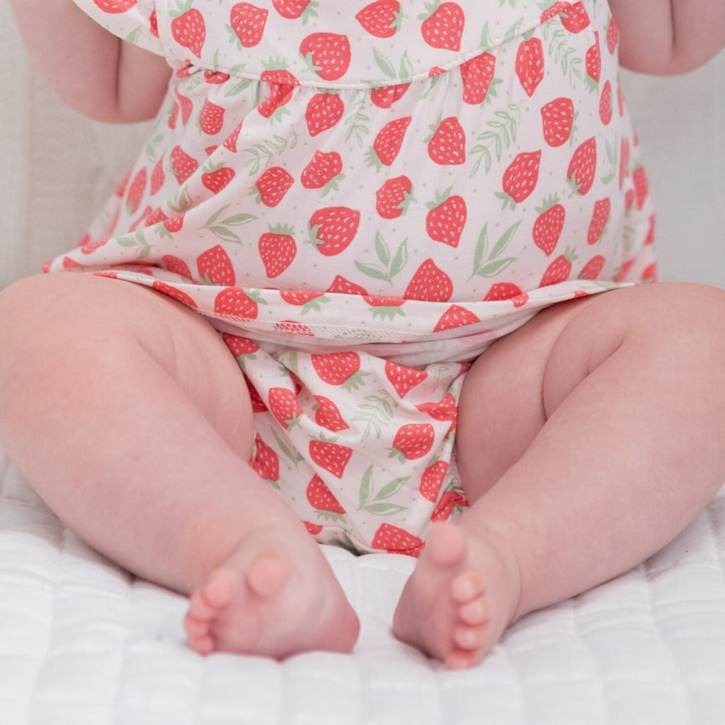 Ruffle dress and bloomer in strawberry print, close-up of gathered waist