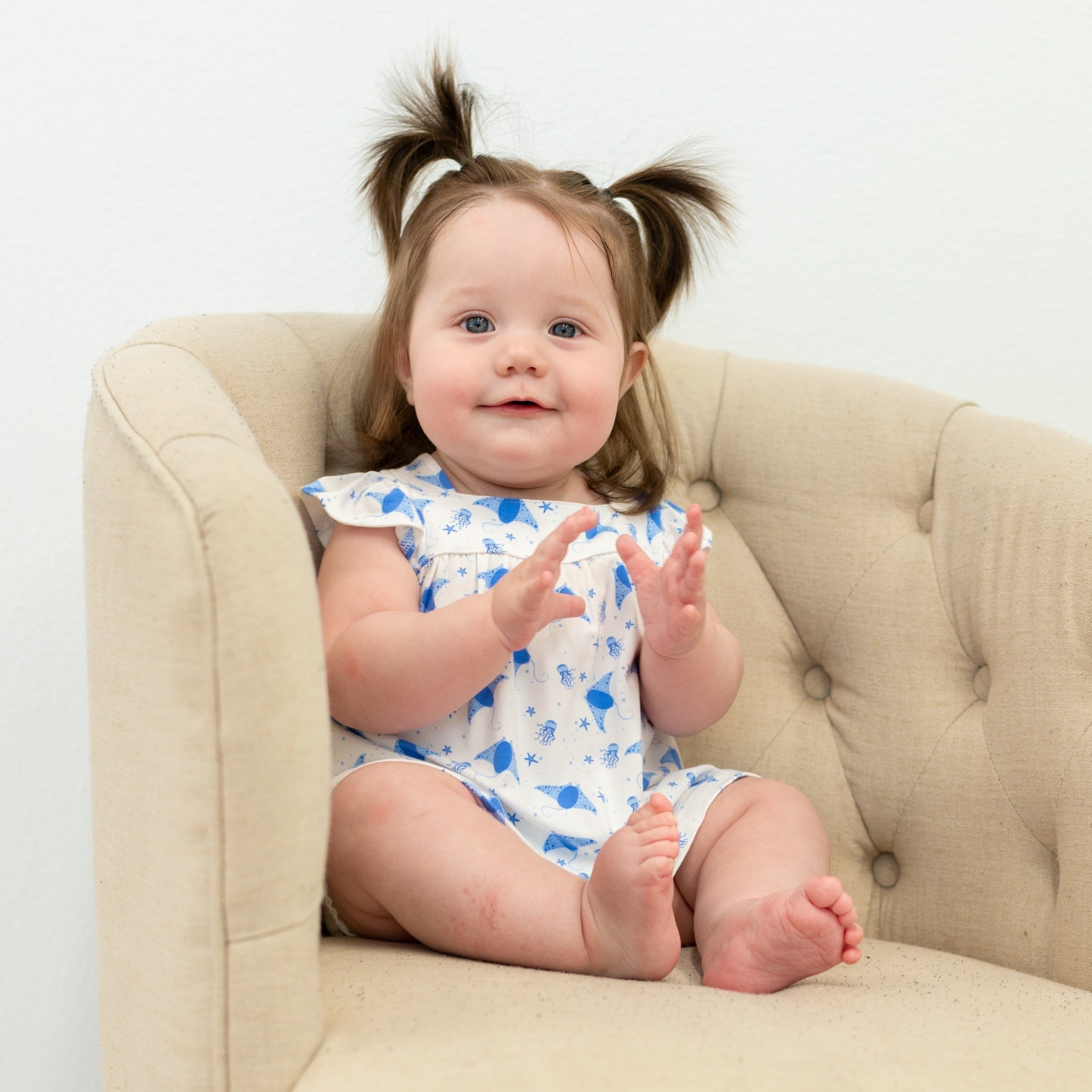 Ruffle baby dress and bloomer set, blue-and-white whale print, sitting