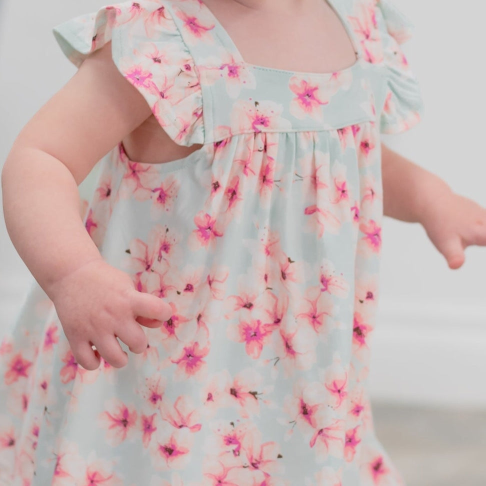 Light blue floral ruffle bodice with pink flower print and gathered waist