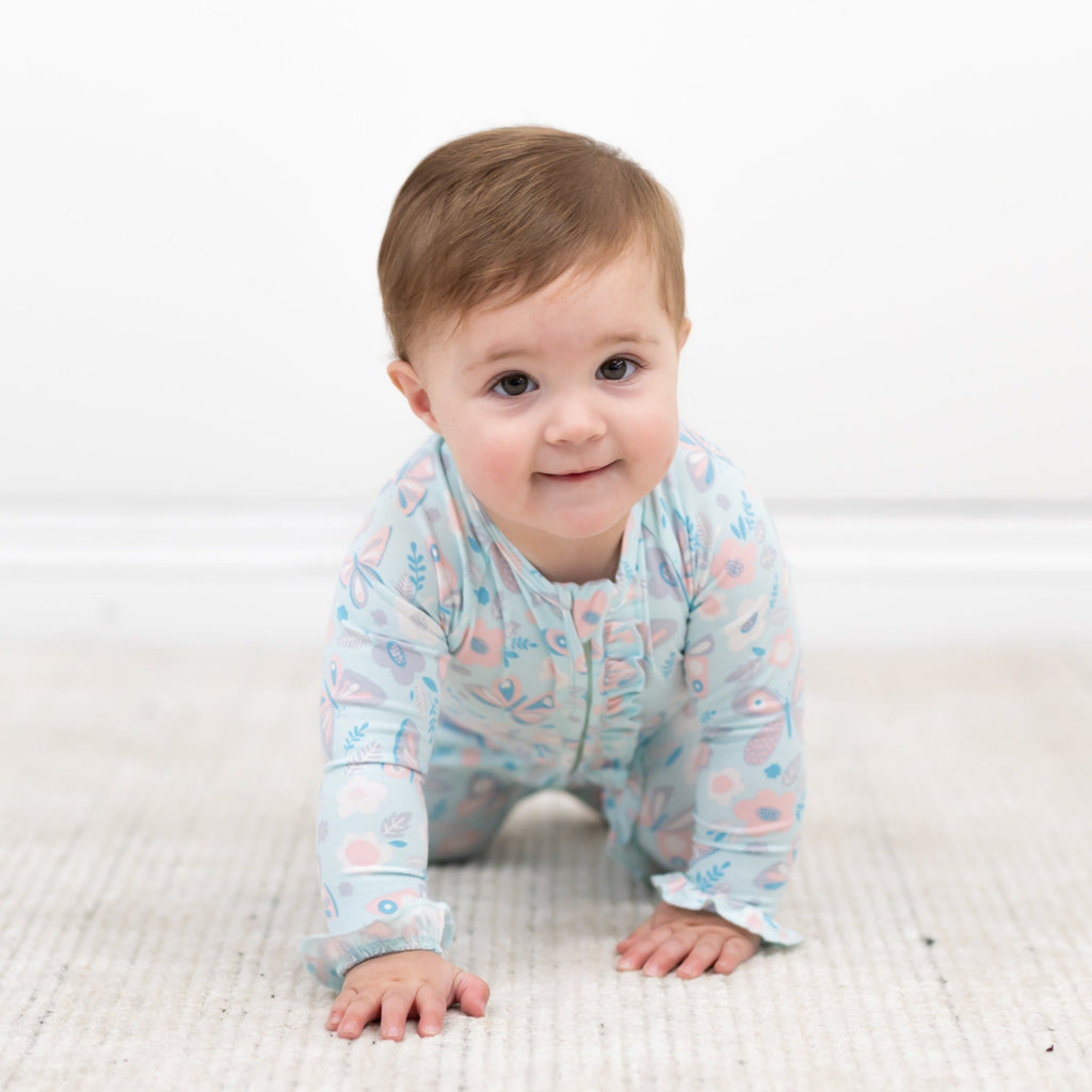Baby ruffle footie with zip front, light blue floral-and-bird print