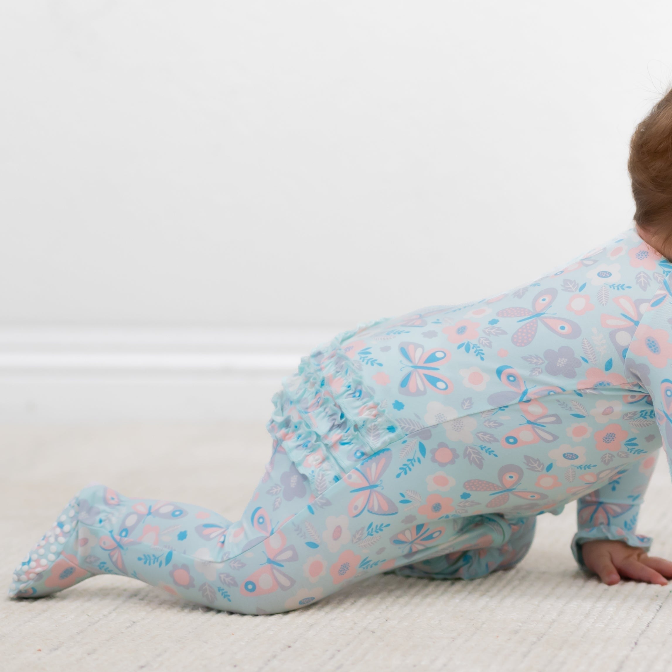 Ruffle footie pajamas with zip front, light blue bird-and-butterfly print