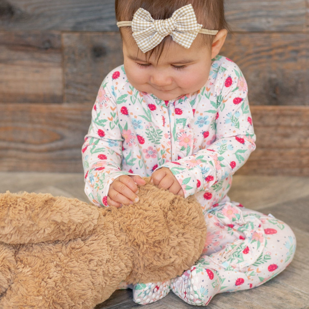 Baby footie pajamas with ruffle collar and floral ladybug print, long sleeves, zip front