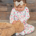 Baby footie pajamas with ruffle collar and floral ladybug print, long sleeves, zip front