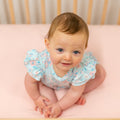 Light aqua ruffle romper with all-over cute bird and butterfly print, short flutter sleeves