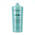KERASTASE Bain Force Architecte shampoo bottle, turquoise plastic with screw cap.