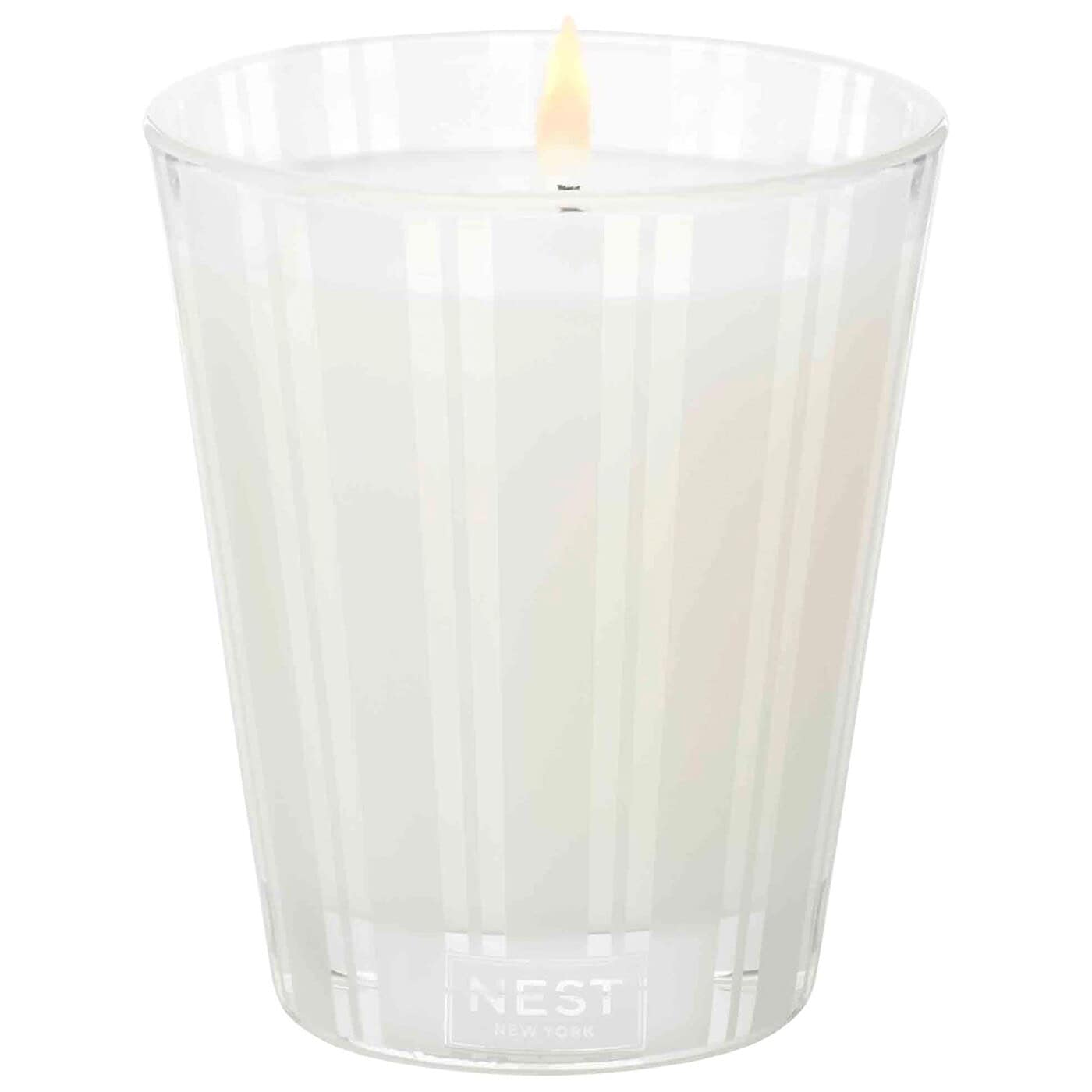 Ocean Mist & Sea Salt scented candle in clear ridged glass with lit wick