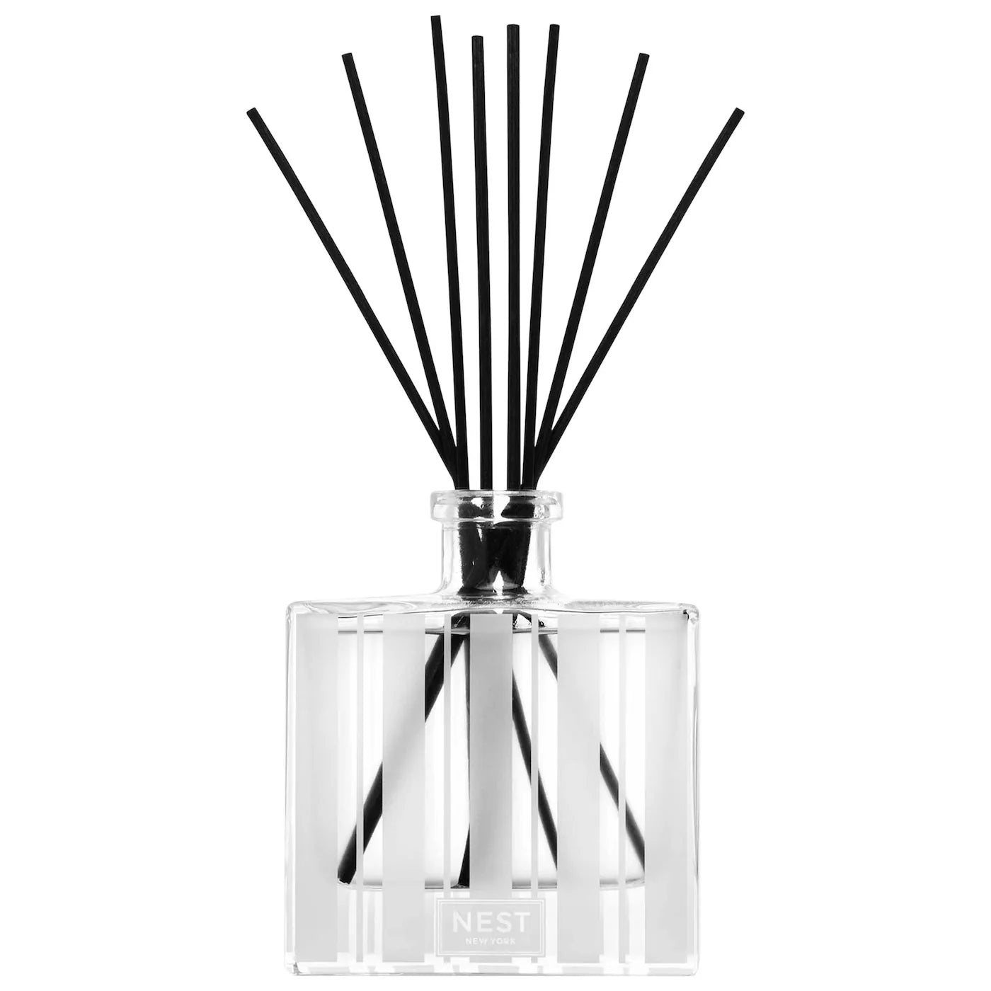 Reed diffuser bottle with clear glass and black reeds, silver collar on top