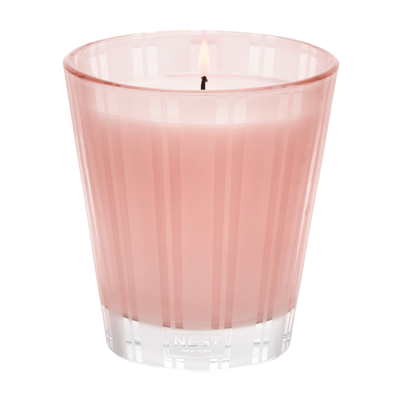 Rosewater candle jar in pink glass with ribbed pattern and NEST logo on base
