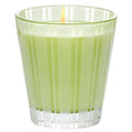 Light green glass candle with NEST label and visible wick flame