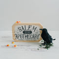 Octagonal wood block sign, 'SALEM APOTHECARY' and 'POTIONS • TONICS • ELIXIRS'