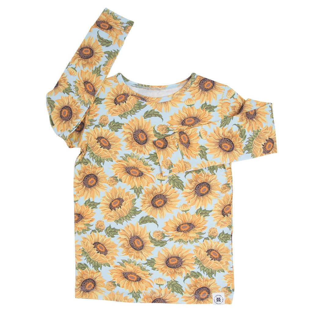 Kids pajama top with yellow sunflower print long sleeves and round crew neckline