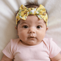 Girl’s sunflower print knotted bow headband in yellow and light blue