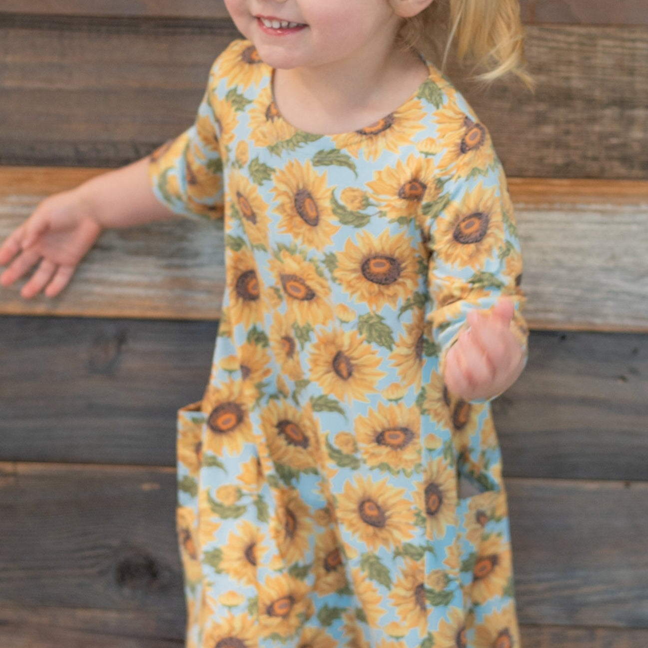 Sunflower print tunic close-up of round neckline and short sleeves