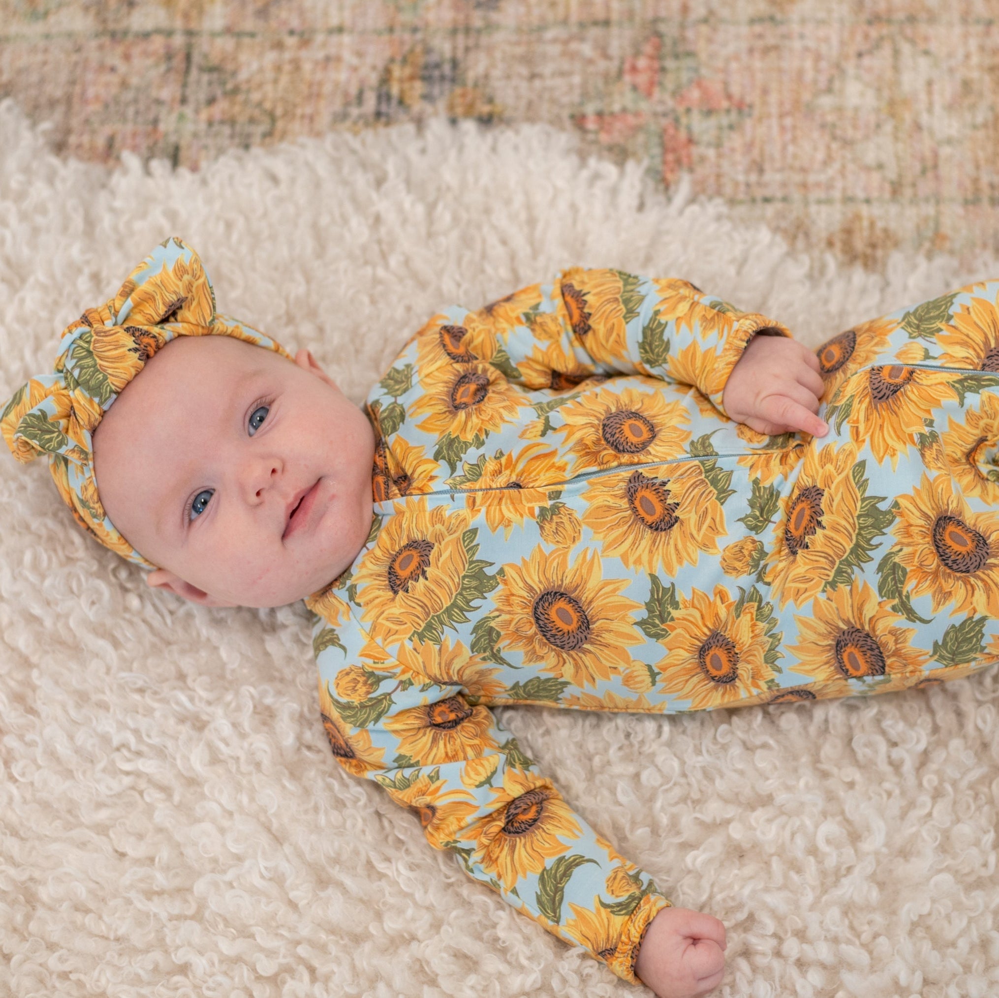 Sunflower print zipper footie for baby, long sleeves, orange-yellow floral pattern