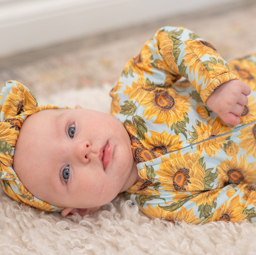 Sunflower zipper footie for baby, long sleeves, orange-yellow floral print all over