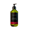 Pre-shave oil pump bottle with amber liquid and sandalwood label