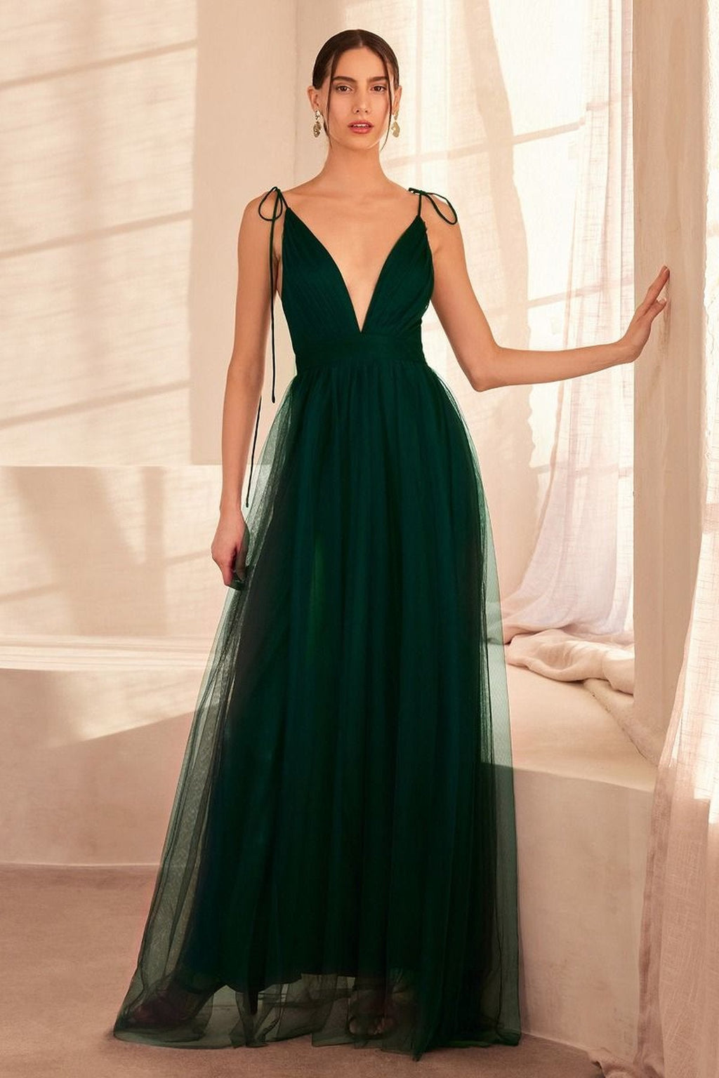 Emerald green V-neck evening dress with thin straps and sheer tiered skirt