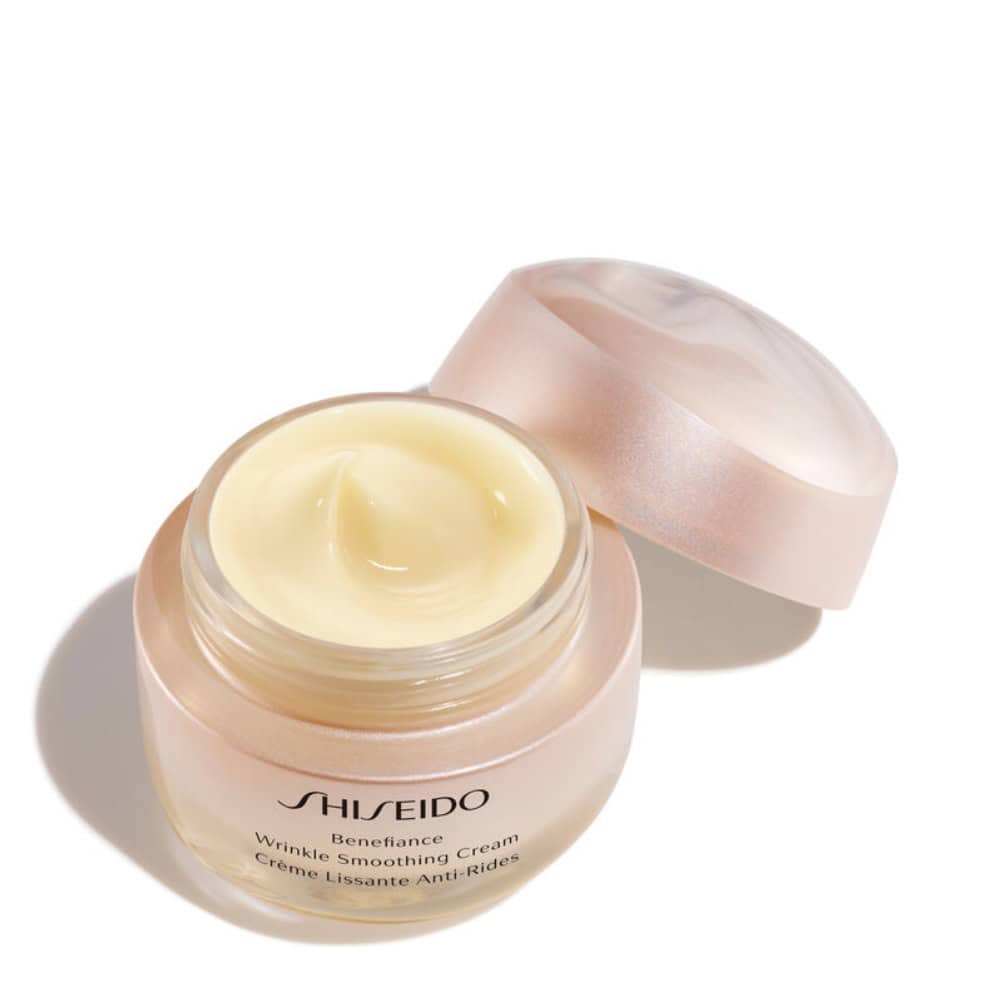 Shiseido Benefiance cream jar with pale cream inside and smooth dollop