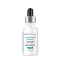 SkinCeuticals Discoloration Defense Serum bottle with black pump and silver collar
