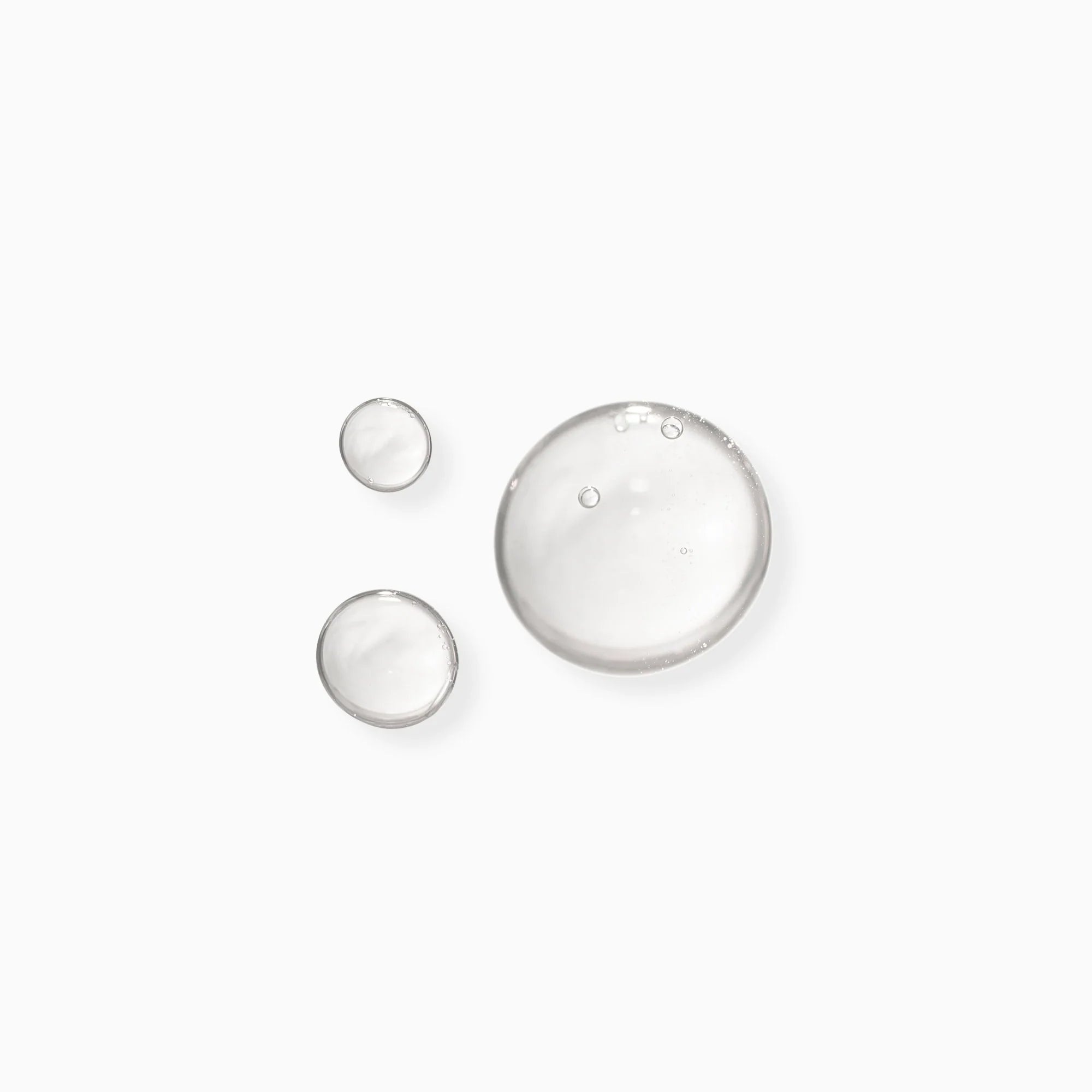 Clear gel serum swatches and small droplets, sample texture
