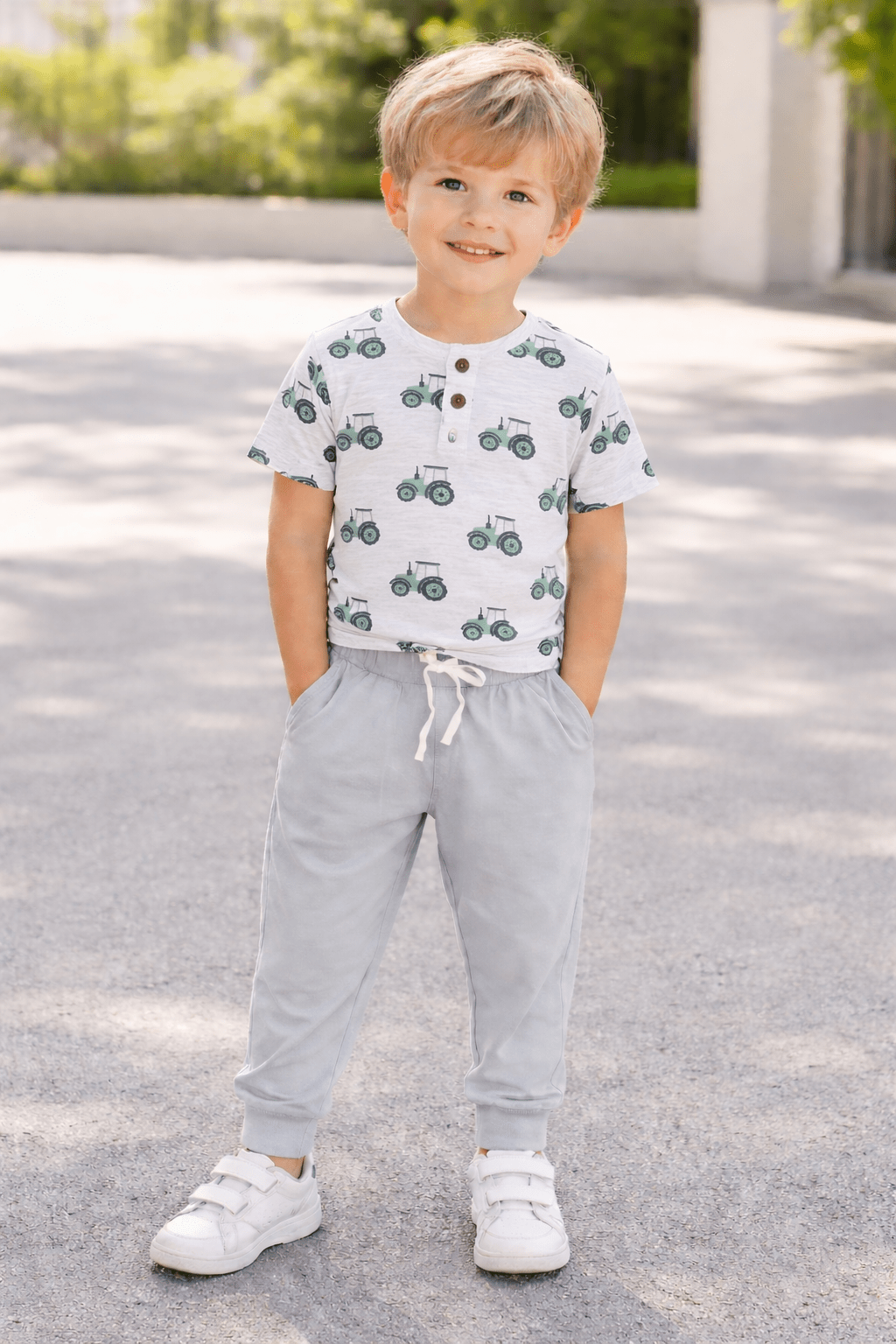 Light grey drawstring pocket pants with white tie and cuffed ankle hems