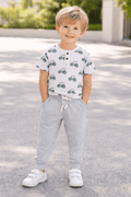 Light grey drawstring pocket pants with white tie and cuffed ankle hems