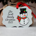 Personalized snowman Christmas ornament with red ribbon and text "She Scott Family Christmas 2021"