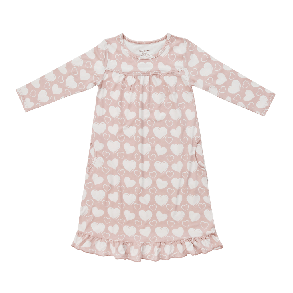 Girls long-sleeve pink dress with allover white hearts and ruffled hem