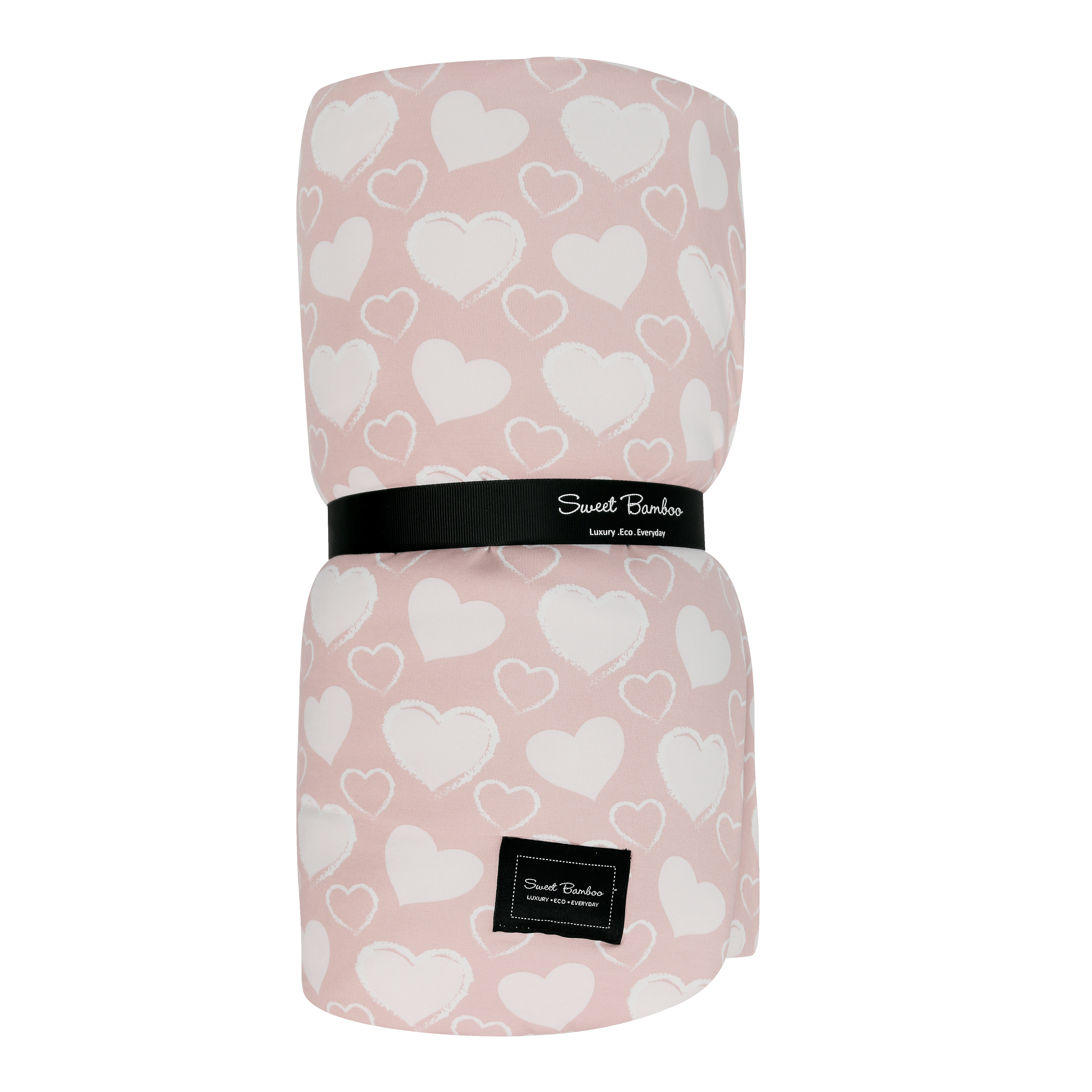 Cloud blanket in blush pink with white heart pattern, black label band
