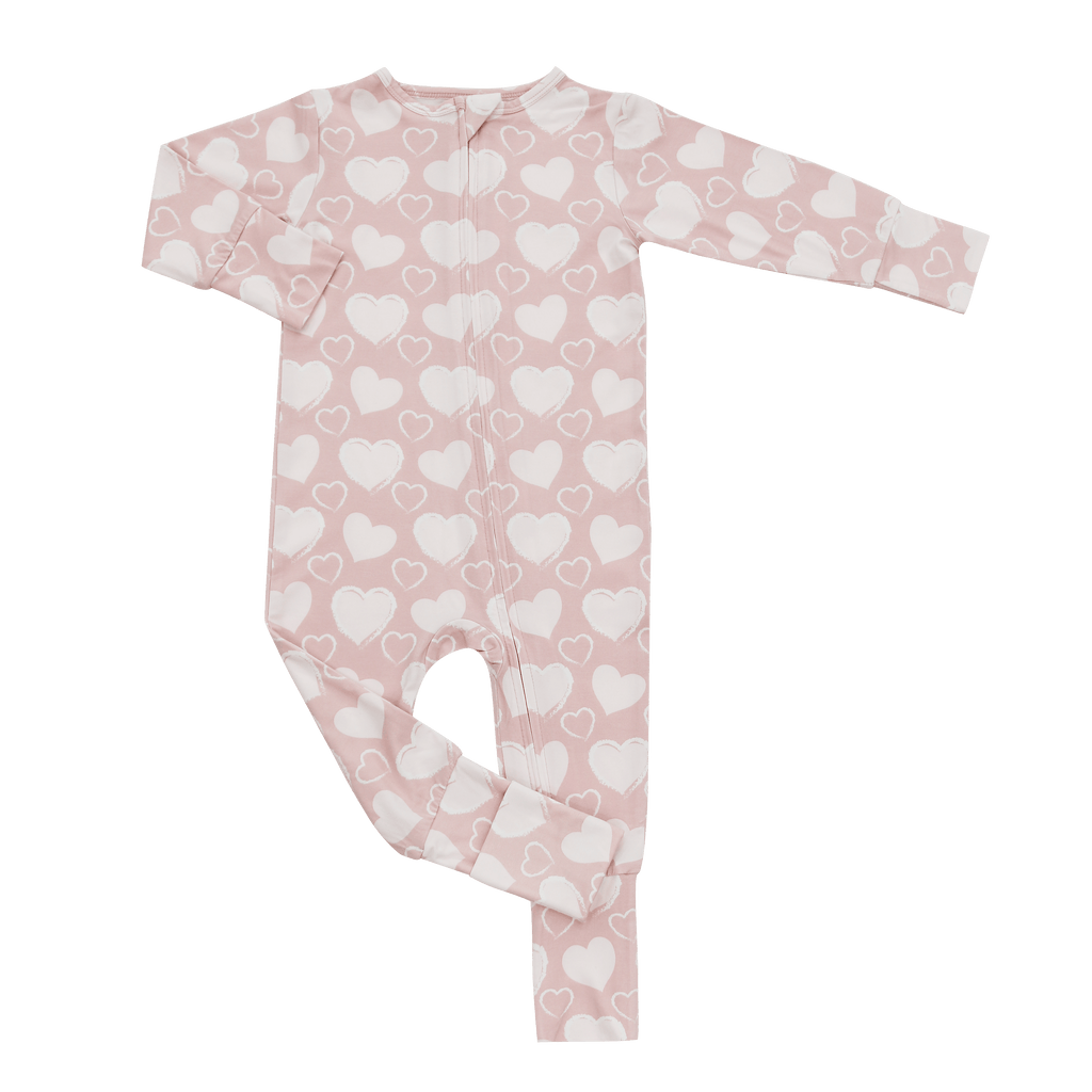 Pink heart-print long-sleeve zip-front convertible romper, full-body view