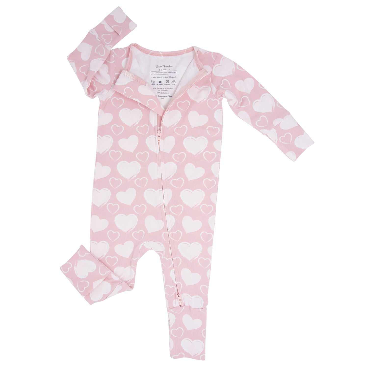 Pink heart-print convertible romper with long sleeves and zip front, side view